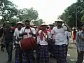 Youths dressed as farmers in the Mangal Shobhajatra, 2015
