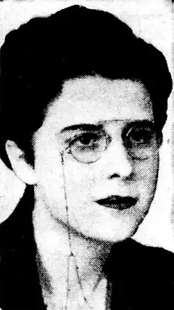 Portrait of a woman wearing glasses with short, dark hair