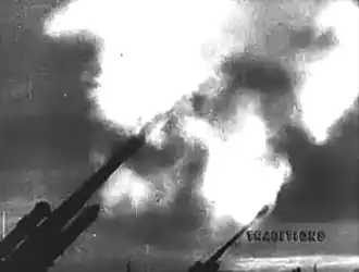 14:24 – Anti-aircraft guns fire at night