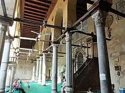 The prayer hall, with the mihrab and minbar visible on the right, along the qibla wall