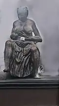 The statue of a mother breast-feeding a child