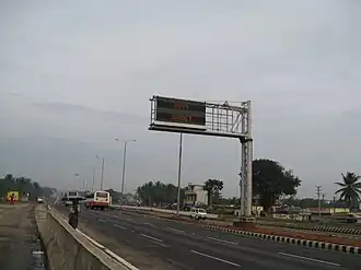 A dual row matrix LED sign on National Highway 4, in Bangalore, India