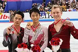 The men's event medalists at the 2012 NHK Trophy