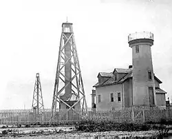 Nantucket Harbor Range Lights with 1856 Brant Point Tower to the right, U.S. Coast Guard photo