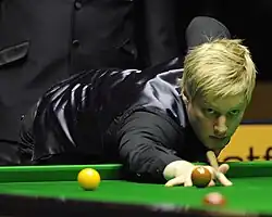 Neil Robertson after playing a shot to the middle pocket