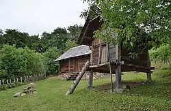 Reconstruction of a house (left) and granary (right) at Burgstallkogel, Austria
