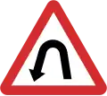 B11: Hairpin curve to the left ahead
