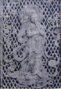 Relief of a Krishna previous Bodhisattva playing a flute on the temple's 8th century Octagonal Lantern.