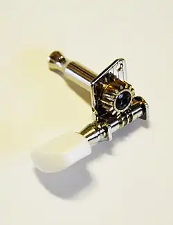 An open machine head, detached from the instrument