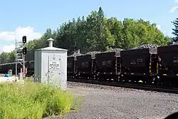 Ore cars carrying iron ore through Iron Junction