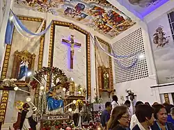 Image of Our Lady of the Rosary by the altar