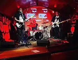 Palm Ghosts playing at Kung Fu Necktie in Philadelphia on 3 March 2023; left to right: Benjamin Douglas, Walt Epting, Joseph Lekkas.[1]