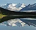 Looking north at Parka Peak centered with Atna Peaks to left reflected in a lake near Donoho Peak