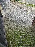 Pattern of Montgomeryshire cobbles at lych gate