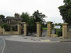 The Cliffe Road entrance gates and lodge* (1861).