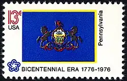 The Pennsylvania state flag as depicted in the 1976 bicentennial postage stamp series.