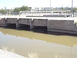 The overflow release on the Grand Canal. Built in 1878, it is located near the end of 48th Street on a parcel owned by the City of Phoenix.