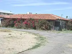 The Dr. Lowell Wormley House was built in 1949 and is located at 1910 E. Broadway Road. Dr. Lowell Wormley was born in Washington, D.C., and studied medicine at Howard University Medical School. When he arrived in Arizona in the mid-1940s, he was one of only three African-American doctors in Phoenix. He was on the staff of both St. Joseph's and Good Samaritan hospitals. He opened his own practice in 1946 in the Midtown Medical Building, 1 N. 12th St., and practiced there until the early 1980s. In 1949, he and his wife, Olivia, built this home on East Broadway Road. The house was listed in the Phoenix Historic Property Register in June 2005.