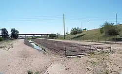 The Old Crosscut Canal was built in 1888 by the pioneers, adjacent to an ancient Hohokam canal which is now filled with soil.