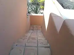 The stairs leading downstairs from the second floor of the Squaw Peak Inn.