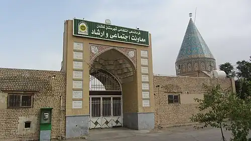 An Islamic building with a dome that looks link a cone