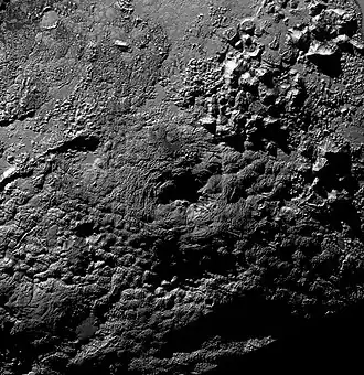 Pluto's possible cryovolcano Wright Mons, showing its central depression