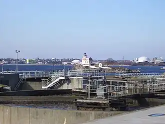 Pomham Rocks Light in 2008 with sewage treatment plant in foreground