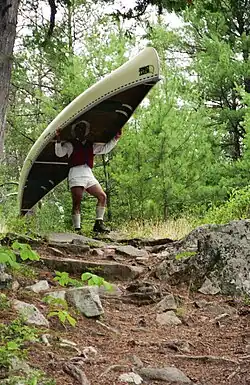 Using a yoke to carry (portage) a canoe between lakes