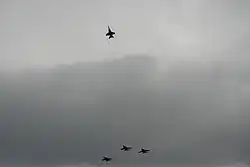 U.S. Navy aviators execute a missing man formation during the memorial flyover of the George Bush Presidential Library Center on December 6, 2018