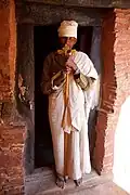 A priest holding the staff