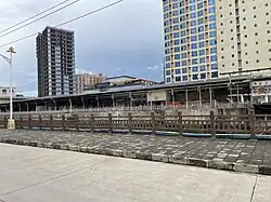 View of the Triumphal Arch area across the Nanma River in downtown Mong La
