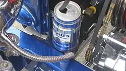 a beer can with a hose going into it