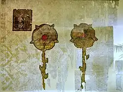 Some of the Juliusbanner given by pope Julius II to the Swiss cantons and their associates included augmentations or "improvements"; shown here is the banner of Rapperswil, with the two roses of the city's coat of arms rendered in gold instead of the usual red.