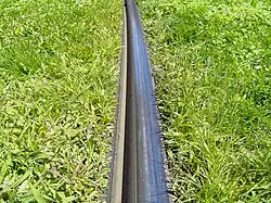 Grooved tram tracks in grass