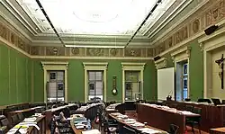 Green parliament hall, with desks