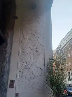 The west side relief by Newbury Abbot Trent next to the Adelphi building entrance. Titled: Recreation on the River.[51]