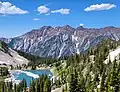 Twin Peaks (left), O'Sullivan Peak (center), Dromedary Peak (right, under cloud), viewed from the south with Red Pine Lake.