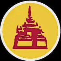 A front view of a yellow and green building with four Chinese characters and an awning sticking out.