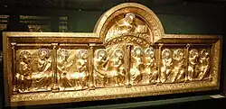 Golden retable, showing Christ above the twelve disciples, shown pairwise.