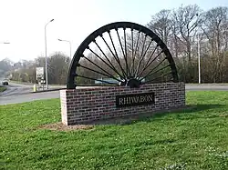 Colliery wheel welcome village sign for Rhiwabon (Ruabon)