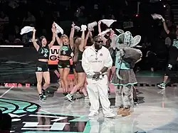 Rick Ross performs with Ellie the Elephant and the Torch Patrol at halftime of a New York Liberty Game during the 2024 WNBA Playoffs.