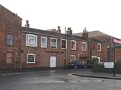 Water Lane and former Round Foundry buildings: No. 99 (left) considered the remains of the Green Sand foundry, built by Matthew Murray. No. 101 (centre) also believed to date from 1795 to 1802.[8]