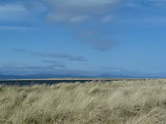 Rubh' na h-Innse Moire in the foreground with Innis Mhòr beyond and the hills of Sutherland in the background.