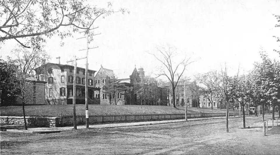 1901 black and white photograph of a city street, Rutgers College academic buildings on the left