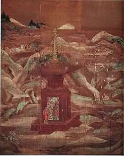 A five-storied pagoda in a landscape with hills and trees. Three people are sitting close to the pagoda on the ground.