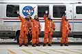 Crew alongside the Astrovan before heading to the launch pad.