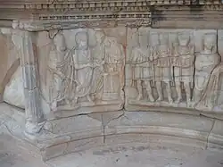 three figures in front of an altar