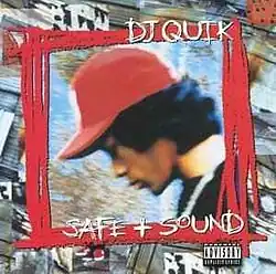 The cover features a a blurred sideways photo of DJ Quik wearing a red baseball cap inside a scratched red square. Both the artist's name and the album title appear above and below him, written in white scratched lettering.