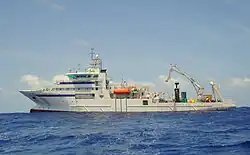 View of the ship at sea, from the left