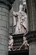 St. Rumbold's statue in St. Rumbold's Cathedral, Mechelen, situated through the arch on the right side.